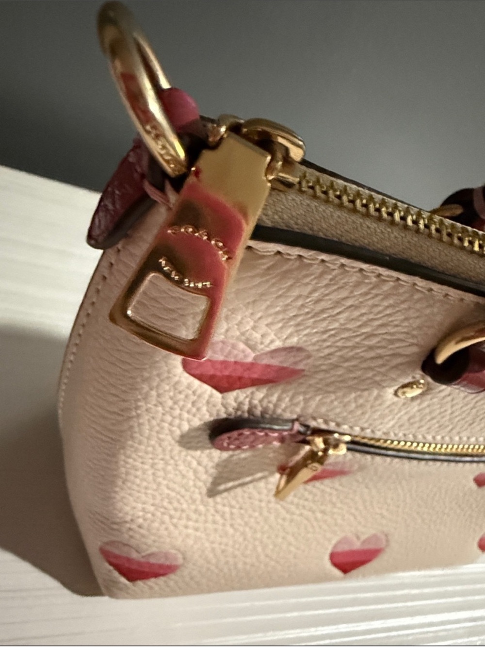 Coach Mini Gallery Crossbody Bag in white with a stripe heart print. - Picture 6 of 11